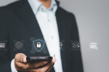 cybersecurity concept, businessman holding smartphone with padlock icon for protecting cyber privacy information. secure internet access technology, security encryption of user private data.