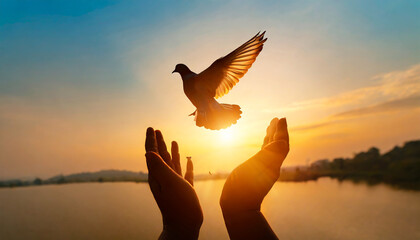 Silhouette pigeon return coming to hands in air vibrant sunlight sunset sunrise background. Freedom making merit concept. Nature animal people hope pray holy faith. International Day of Peace theme - obrazy, fototapety, plakaty