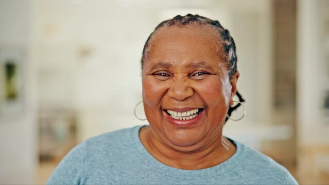 Portrait of senior black woman in home, laughing and relax with wellness, pride and confidence in apartment. Retirement, peace and face of old person in living room, happy grandma in South Africa.
