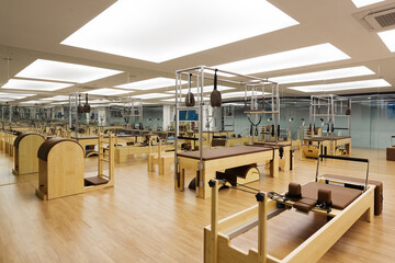 Exercise equipment and machines in empty pilates studio
