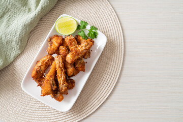 Fried Snapper Belly on white plate