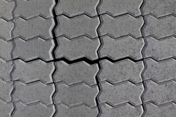 several cement pavers seen from above, demonstrating their line shape and fit between them, good resistant and decorative material