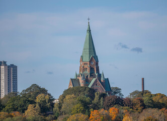 Fototapeta premium The church Sofia kyrka, and apartments in the district Södermalm, a sunny autumn day in Stockholm