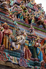 Veeramakaliamman Temple Singapore.
details of the Hindu art  on the facade of Sri Veeramakaliamman Temple in Little India, Singapore. - 665920560