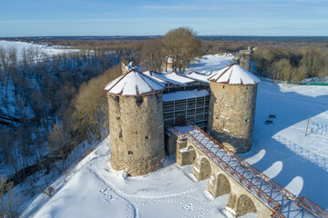 Ancient Koporye fortress in a winter landscape on a sunny day (aerial photography). Koporye. Leningrad region, Russia