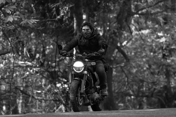 man on motorcycle, black background