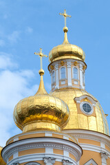 Fototapeta na wymiar Two domes of the ancient Cathedral of the Vladimir Icon of the Mother of God on a sunny day. Saint-Petersburg, Russia