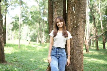 world saving concept Happy female tourist amidst forest