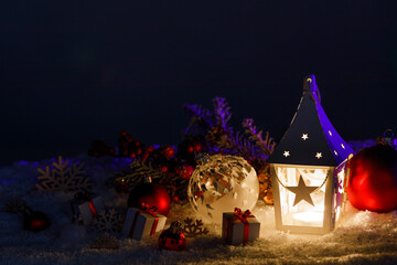 Christmas lantern and decor in snow