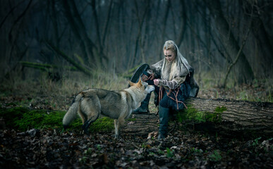 Misty Forest Encounter: Viking Woman Warrior in Traditional Armor, with Shield, Bonds with a Majestic Wild Wolf Amidst Ancient Trees.