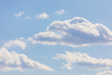 White bird clouds under the blue sky. sunny weather
