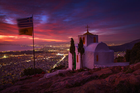 Prophetess Ilias church and view of Athens at dusk.