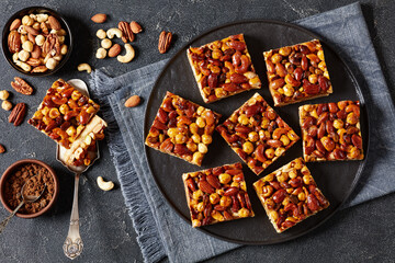 toffee mixed nuts shortbread bars on black plate