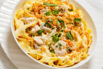 creamy chicken and mushroom tagliatelle in bowl