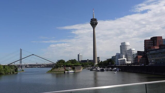The Rhine Tower, Dusseldorf Harbor Bridge and Neuer Zollhof flat complex in Dusseldorf, Germany