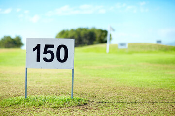 Golf course, sports and number with board for sign on driving range in summer for tournament. Lawn, grass and green for game or professional match, hobby and fun at club for relaxing activity