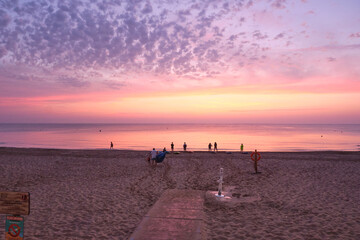 Sunrise with pink colors on the seashore