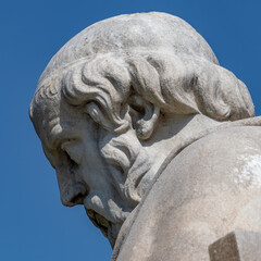 Plato bust marble statue, the ancient Greek philosopher, isolated on clear blue sky background. Travel to Athens, Greece.
