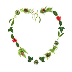 Christmas heart shape wreath with holly, mistletoe and traditional winter greenery. Romantic symbol...