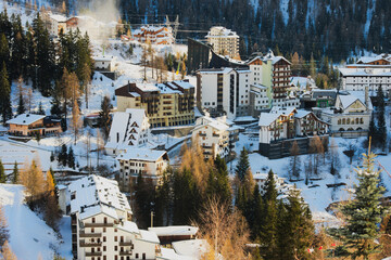 Fototapeta na wymiar Snow-covered village. Ski resort. Foppolo, Bergamo Alps, Italy