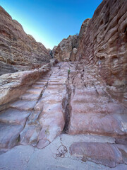 Stairs in the rock along Al-Kubtha Trail (Indiana Jones Trail) in the historic and archaeological...