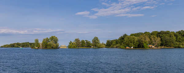 Panoramic photo of multiple islands in the Thousand Islands archipelago on the Saint Lawrence river, Canada