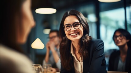 Smiling hipster woman in modern office, colleagues in background.
