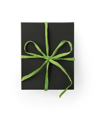 Top view of black gift box with green ribbon bow isolated on white