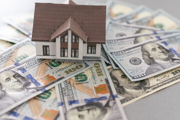 Small Model House on Newly Designed U.S. One Hundred Dollar Bills.