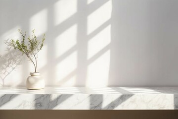 White marble tabletop or countertop in modern and minimal wall room with dappled sunlight and tree shadow from window at home