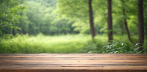 Empty wooden tabletop over green forest background, product display montage.