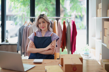 Portrait Of Asian Female Owner Of Fashion Store Clothing Store successful happy smile at small...
