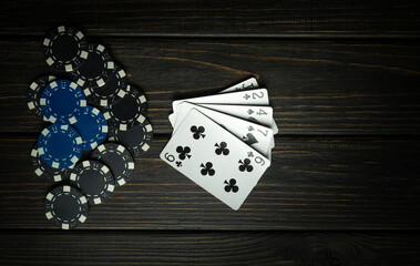 A losing hand or combination of cards in a poker game. Bankrupt or loser concept on black background