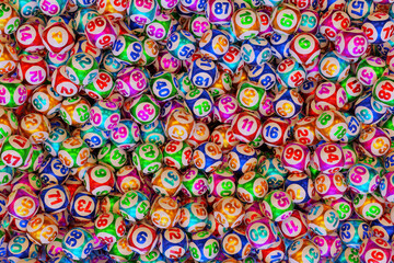 Lots of multi-colored lottery balls with numbers. Top view 3d rendering