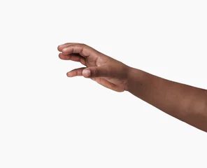 Fotobehang African child hand with gesture of catching against a white background © cunaplus