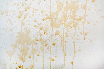 Close up of coffee stains on white wall