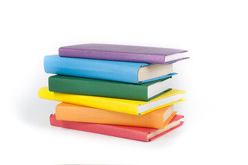 stacking. Open book, hardback books on white background. Back to school. Copy space for text.