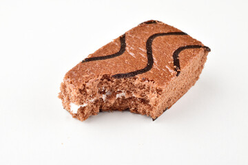 Bitten chocolate pastry isolated on white background