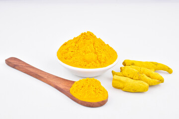 Raw turmeric with powder on white background