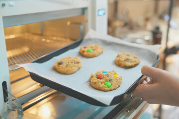hand holding a tray with cookies