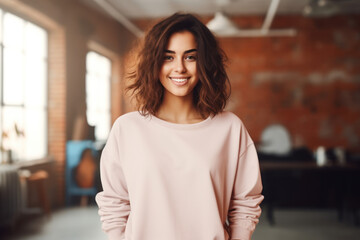 Young blond woman wearing blank soft pink sweatshirt stands in front of camera. Fashion mockup with copy space. Sweatshirt template. Generative AI