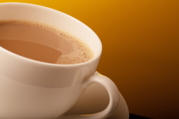 Closeup of milk tea cup on yellow background