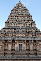 Ancient hindu temple tower. Airavatesvara Temple against blue sky background in Darasuram, Kumbakonam, Tamilnadu.