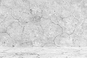 Dirty old cracked concrete wall and floor texture background. Abandoned empty cement room with scratches, mold and lots of stains. 
