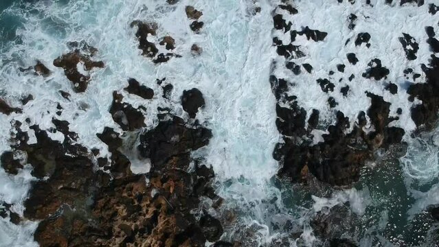 Waves smashing through rock