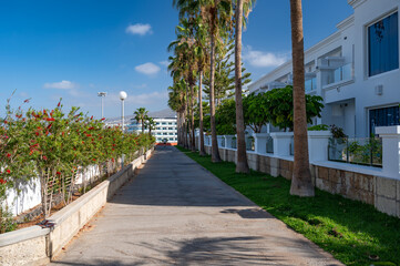 A footpath, next to a row of holiday apartments, in Tenerife, Spain. Tenerife is a popular tourist...