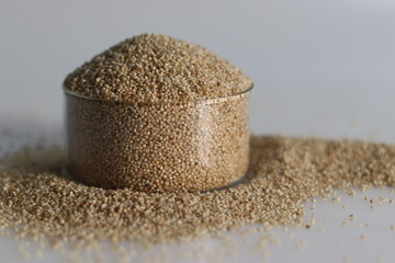 Closeup of banyard millet, a healthy grain, in a glass bowl filled to the brim - obrazy, fototapety, plakaty