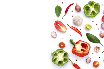 Various fresh vegetables and herbs on white background.