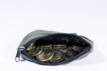 Open wallet with euro coins.