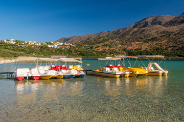 Fototapeta na wymiar Water bikes on lake Kournas, Crete, Greece